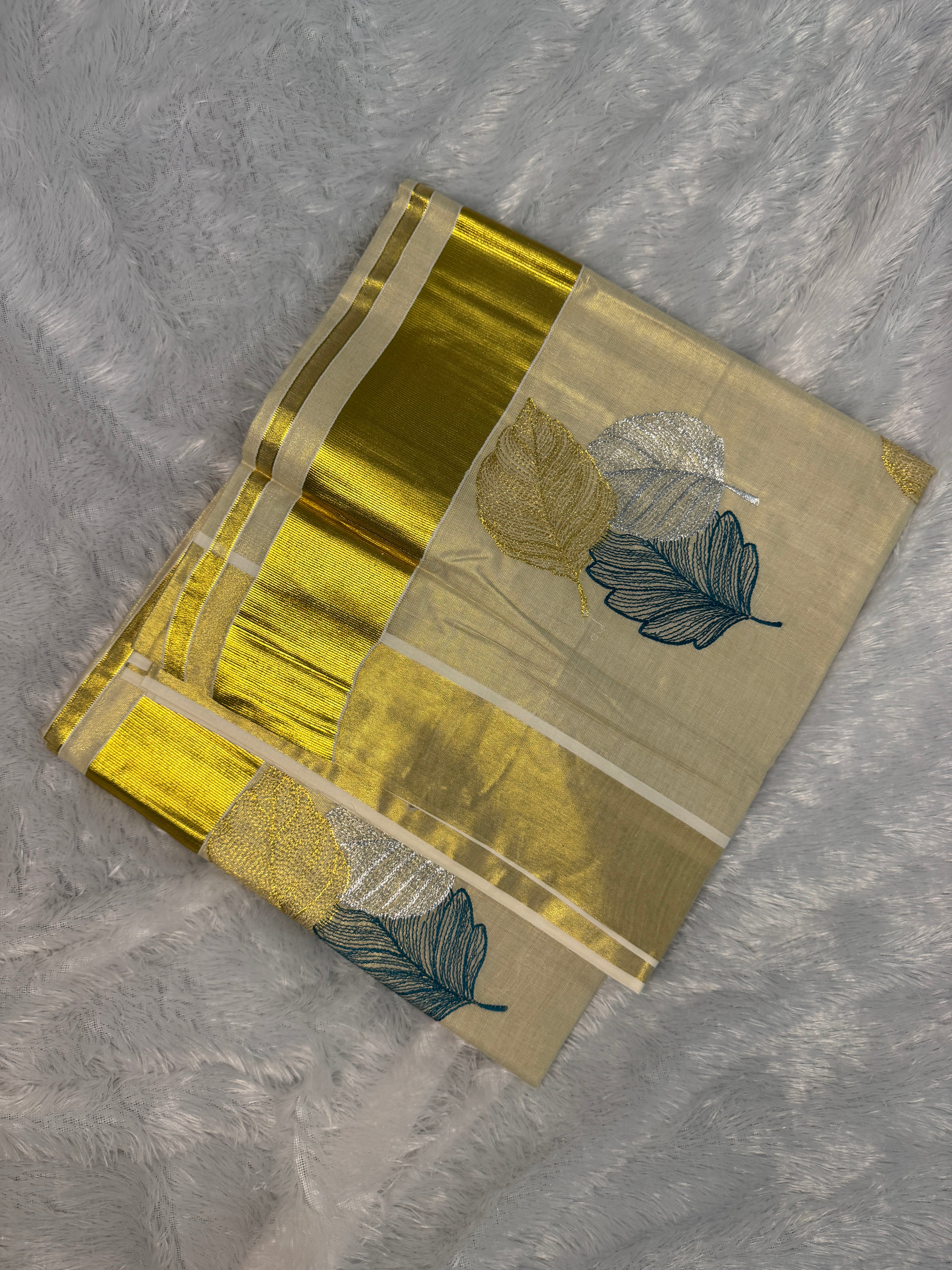 Gilded Shimmer Tissue Kerala Saree with Metallic Tri-Leaf Embroidery