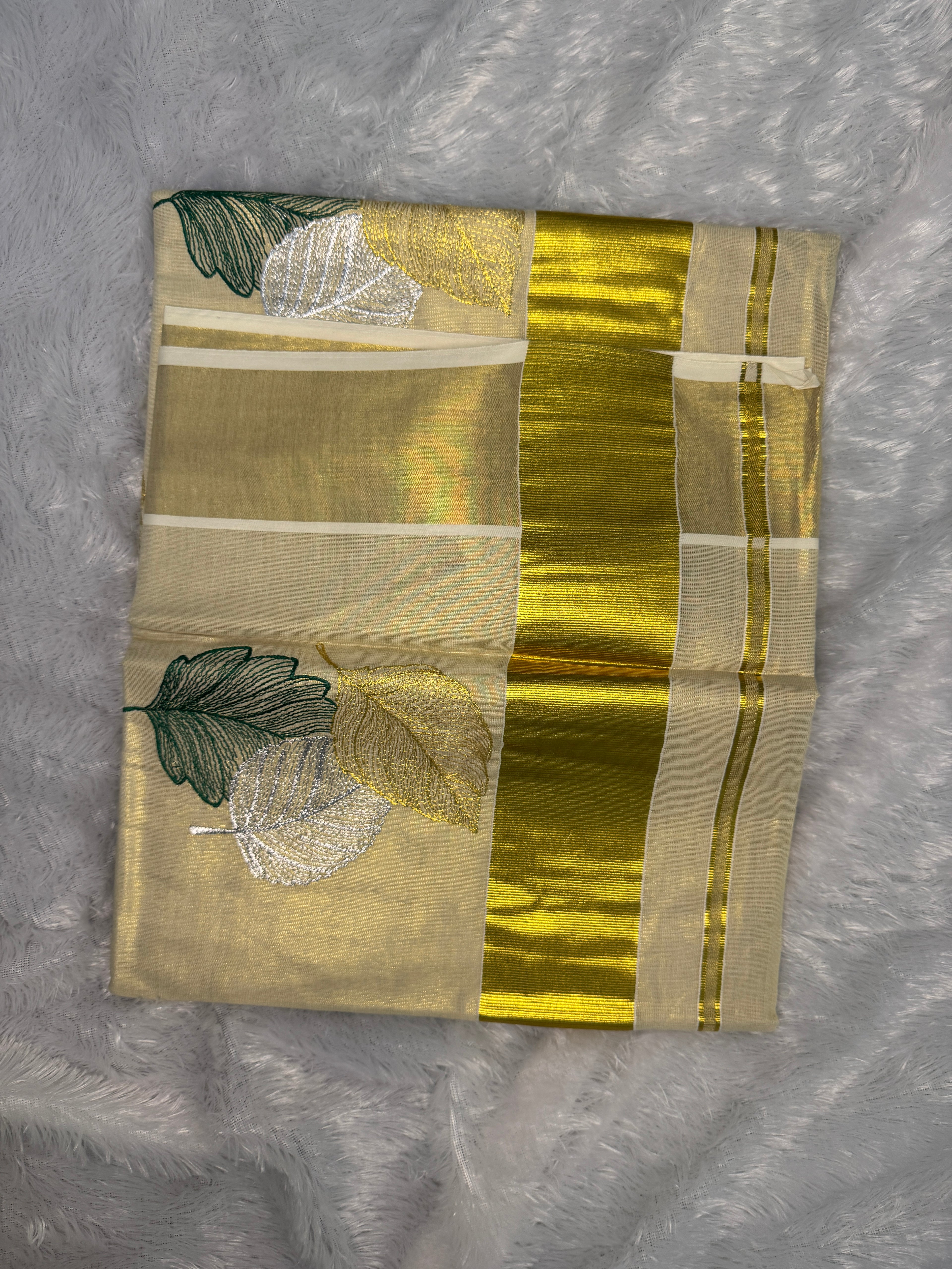Gilded Shimmer Tissue Kerala Saree with Metallic Tri-Leaf Embroidery