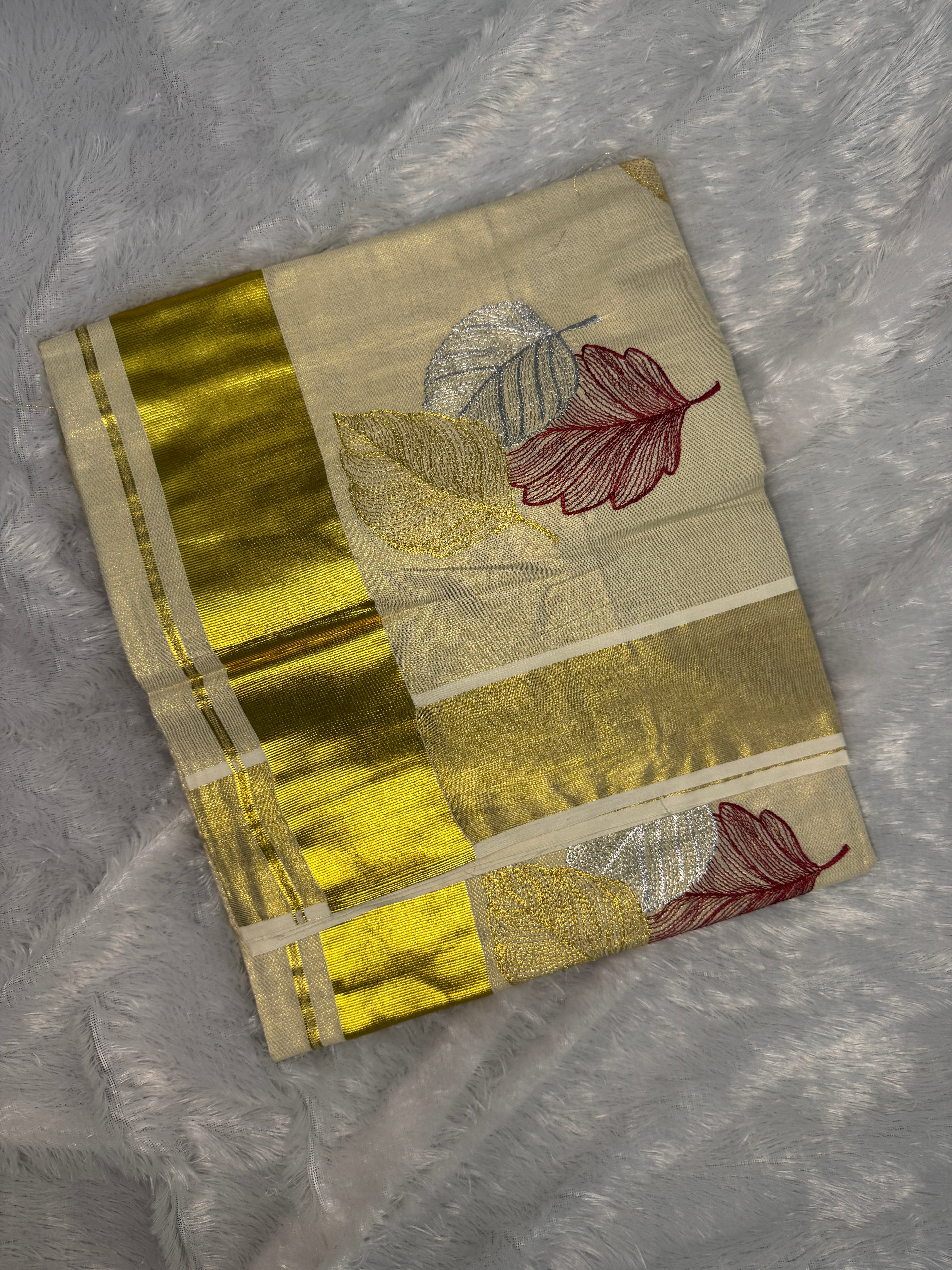 Gilded Shimmer Tissue Kerala Saree with Metallic Tri-Leaf Embroidery